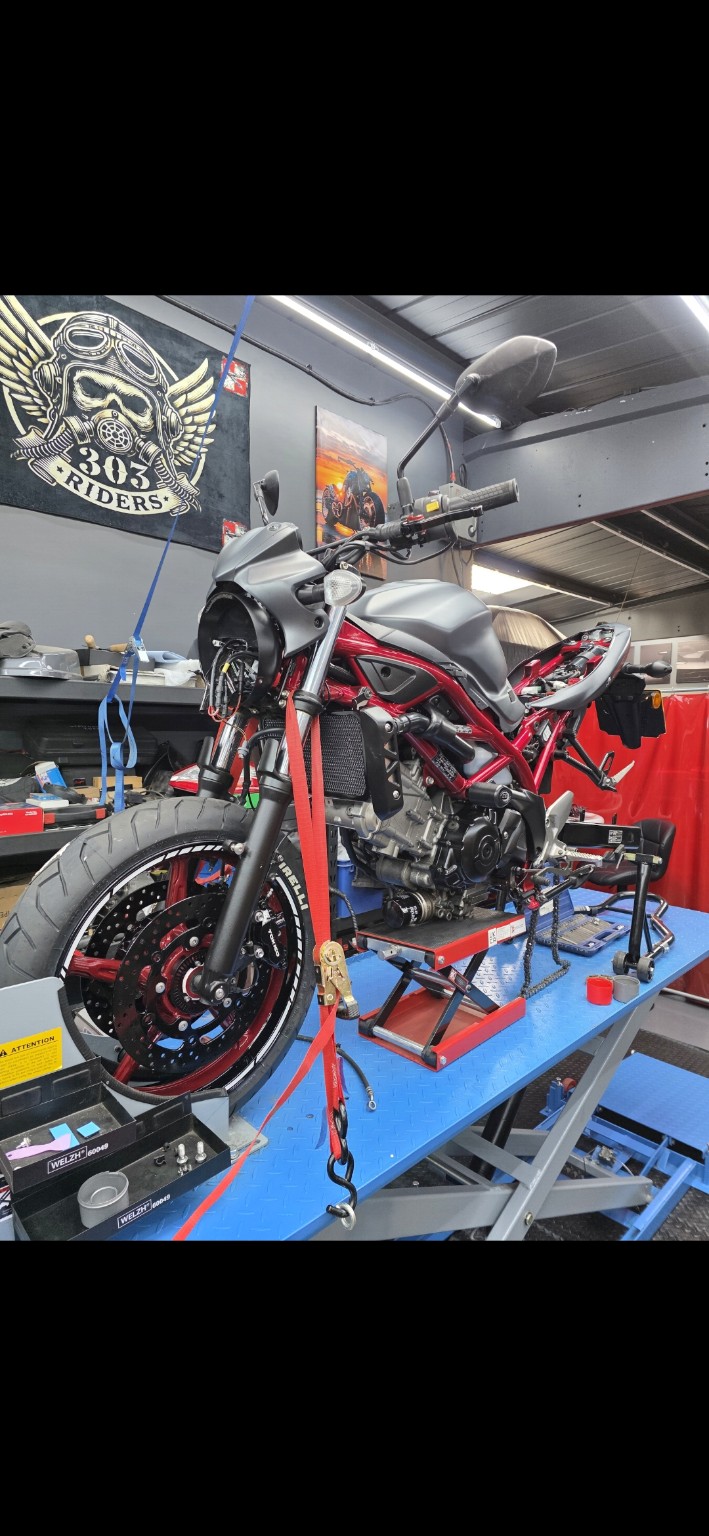 Suzuki motorcycle on a dedicated motorcycle lift